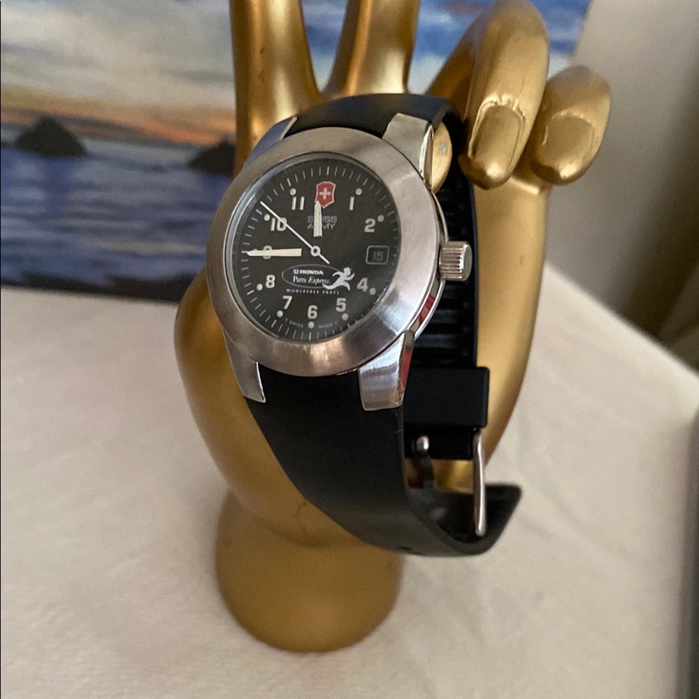 Swiss Army Black and Silver watch with rubber watch band.